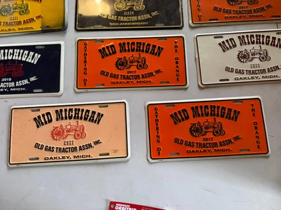 (8) Assorted license plates