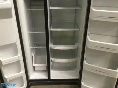 USED GE STAINLESS STEEL AND BLACK SIDE X SIDE REFRIGERATOR HEAVY DUTY ENERGY STAR