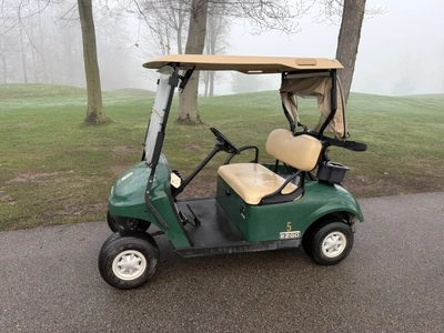 (1) 2015 E-Z-Go golf cart with a Kawasaki gas engine, includes canopy, ball cover, club cover, fold-...