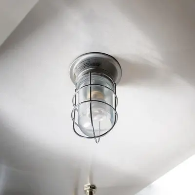 Glass globe for hood light bulb