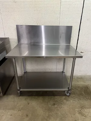 Used Falcon Restaurant Supply Used 48"X30" Stainless Table with 16" Backsplash on Casters - FG Food Prep Tables Illinois US | Falcon Restaurant Supply #1375231
