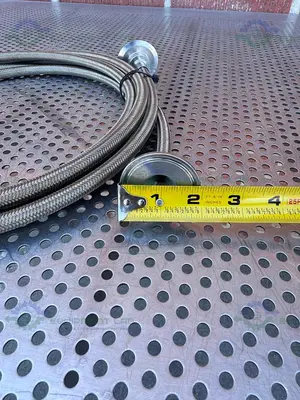 USED FLEXIBLE 200" STAINLESS STEEL BRAIDED HOSE W/ 1"  SANITARY FITTING