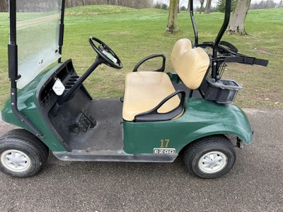 (1) 2015 E-Z-Go golf cart with a Kawasaki gas engine, does not include Club canopy, includes ball wa...
