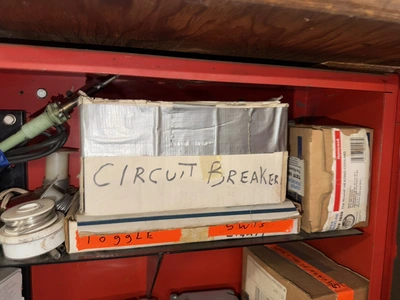 (2) Auto Call single door storage cabinets filled with assorted electrical items, including Push Mat...