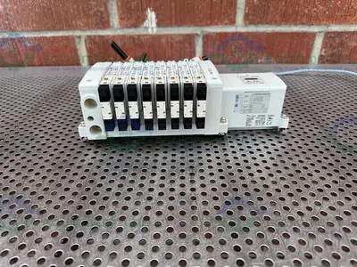 USED SMC EX-250-SDN1 INTERFACE SERIAL UNIT W/ 8 SMC VQ2A01N-5B- X65 SOLENOID VALVE