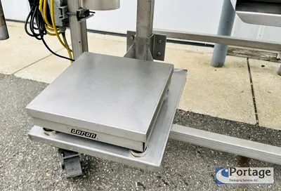 USED HEINZEN MANUFACTURING INTERNATIONAL 2720 MANUAL PACKING TABLE W/ DUAL SCALES