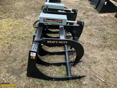 New Tomahawk 78” brush grapple attachment, two hydraulic grapple arms, skid steer quick attach