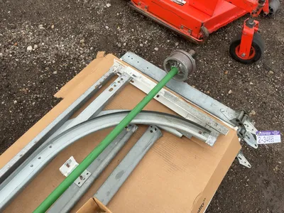Used 8’ Tall x 10’ Wide Insulated Roll Up Door, comes with tracks, spring, and hardware, four panels...