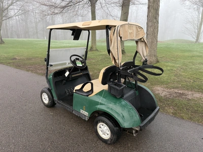 (1) 2015 E-Z-Go golf cart with a Kawasaki gas engine, includes canopy, ball cover, club cover, fold-...