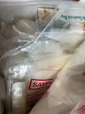 Box of Plastic Storage Bags and Round Paper Tags with Strings