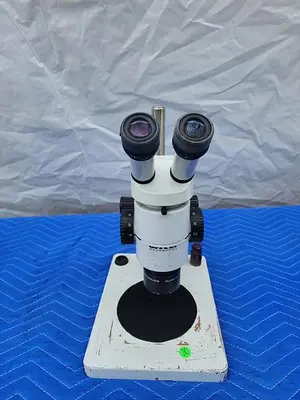 WILD HEERBRUGG MICROSCOPE WITH PLAN 1X (2 EYEPIECES LEICA 10X21B)