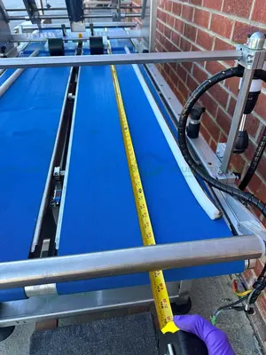 USED REDEMAC STAINLESS STEEL DUAL CONVEYOR PACKAGING MACHINE W/ OPTEL PHARMAPROOF