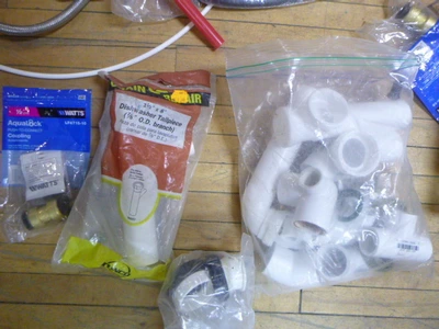 Tote of Plumbing Supplies