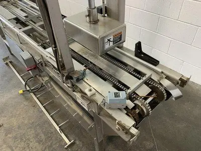 Pneumatic Press on Chain Conveyor