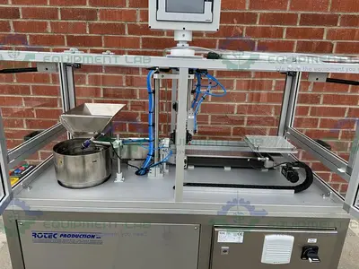 USED ROTEC PISTONMACHINE FOR VIAL CAPS / STOPPERS W/ VIBRATORY FEEDER BOWL
