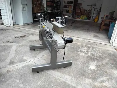 Quadrel model Moduline wraparound pressure sensitive labeler