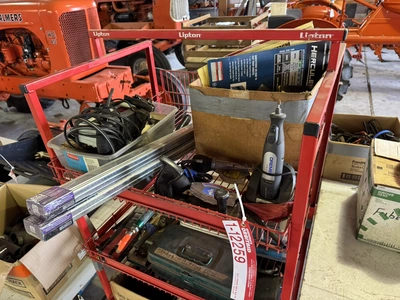(1) small wire shelf with assorted contents, includes Dremel tool, small battery charger, pneumatic ...