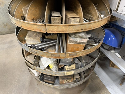 (1) 7-tier lazy Susan style parts rack, approx. 66" tall, includes assorted socket head cap screws, ...