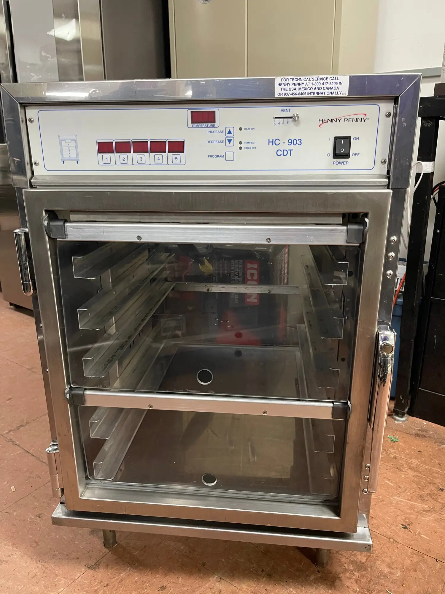 Used Henny Penny Used Henny Penny HC-903 CDT Heated Holding Pass Thru Cabinet with Flip Doors and Timers 120V Hot Food Warming, Holding, & Transport Cabinets Illinois US | Falcon Restaurant Supply #1375758