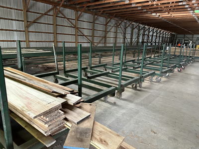 6 strand, 120' green chain with incoming deck and hoist. 24 heavy duty carts