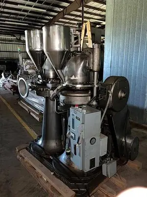 Manesty model Drycota 23 station consisting of (2) presses with transfer system