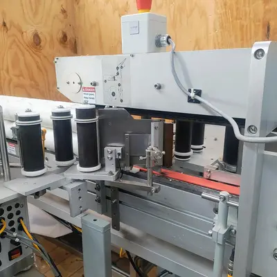 LSI Front and Back Labeler with integrated hold down