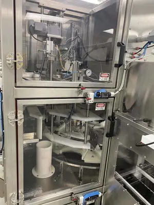 Inline Filling Systems Net-Weight Rotary Jar Filler with Integrated Capping for Clean Room Application in Semi-Conductor Industry, 2009