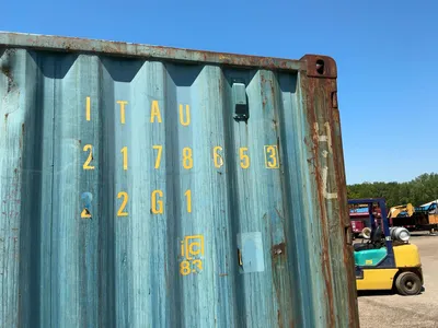 20’ Shipping / Storage Container 8’ wide x 8’ 6” tall, swing doors on one end, wood deck, rings for ...