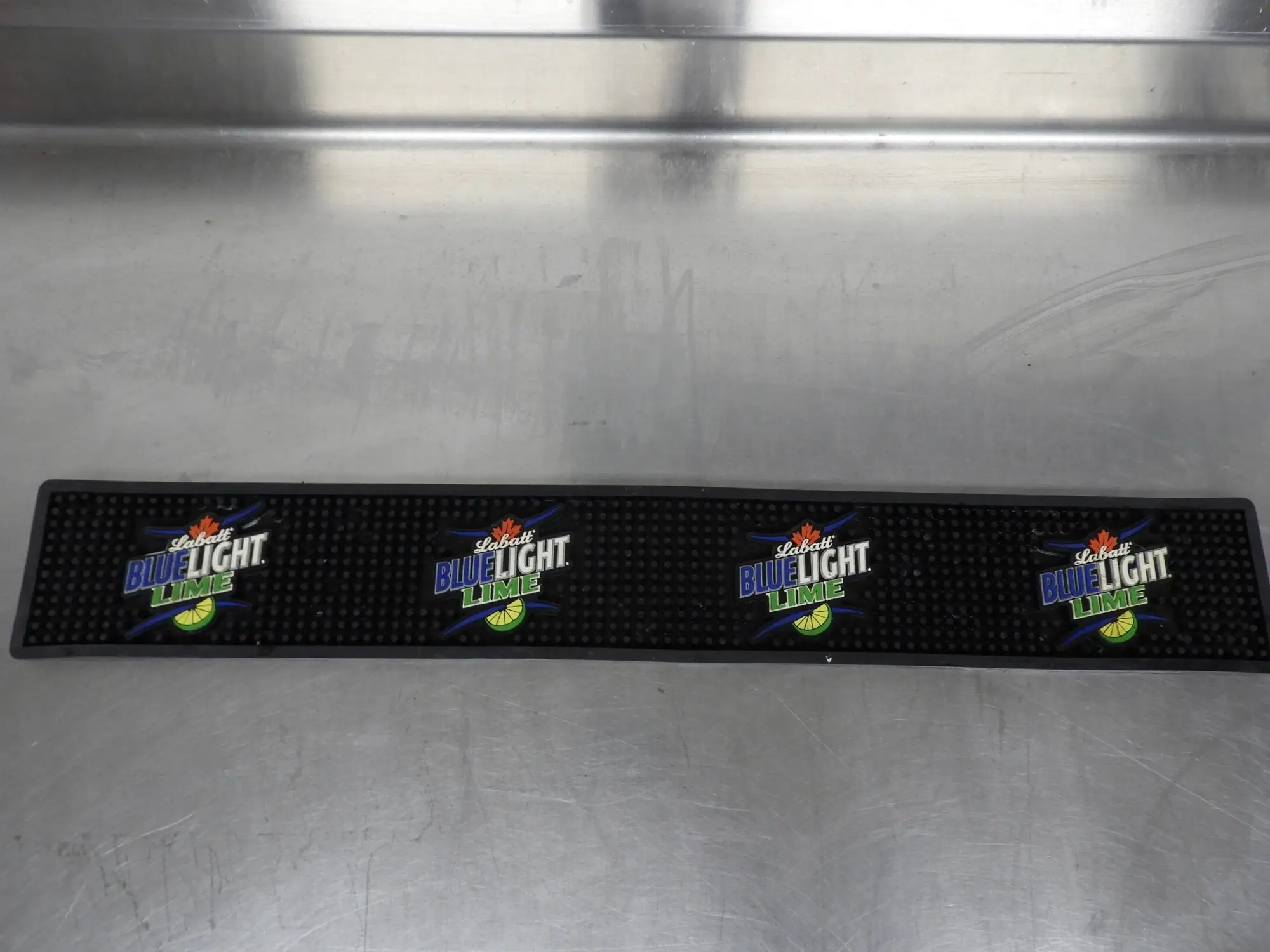 Used Falcon Restaurant Supply Used Labatt Blue Light Lime Beer Tap Bar Mat Drip Catcher 24"x3.5" Underbar Equipment Illinois US | Falcon Restaurant Supply #1376544