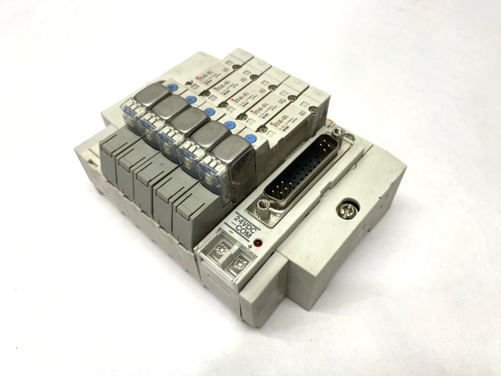 USED SMC PNEUMATIC MANIFOLD ASSEMBLY 5 STATIONS 1/4" PORTS 24VDC