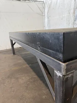 50" X 124" DRILLED & TAPPED STEEL LAYOUT TABLE W/ STAND. STOCK # 0667025.