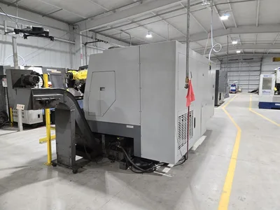 Hyundai SKT-400C F21ITB CNC Lathe w/ Tailstock and Indexer, 10 Slot Turret, LNS Conveyor, 3-Jaw