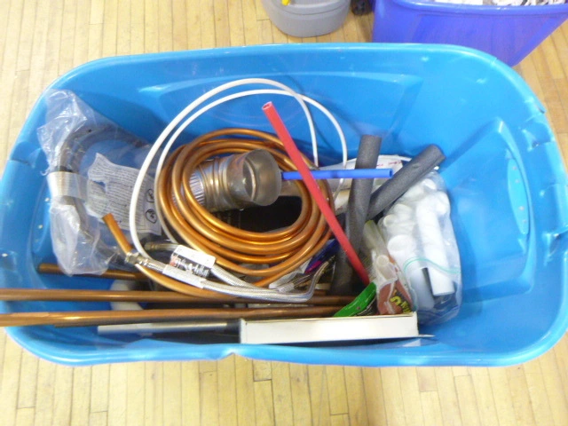 Tote of Plumbing Supplies
