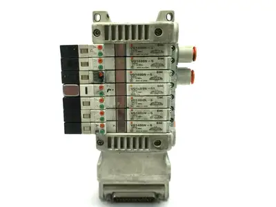 USED SMC PNEUMATIC PLUG IN MANIFOLD W/ VALVES