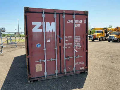 20’ Shipping / Storage Container 8’ wide x 8’ 6” tall, swing doors on one end, wood deck, rings for ...