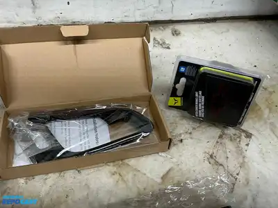 Box of various car parts and accessories including: red and black rearm rest covers, Chevy...