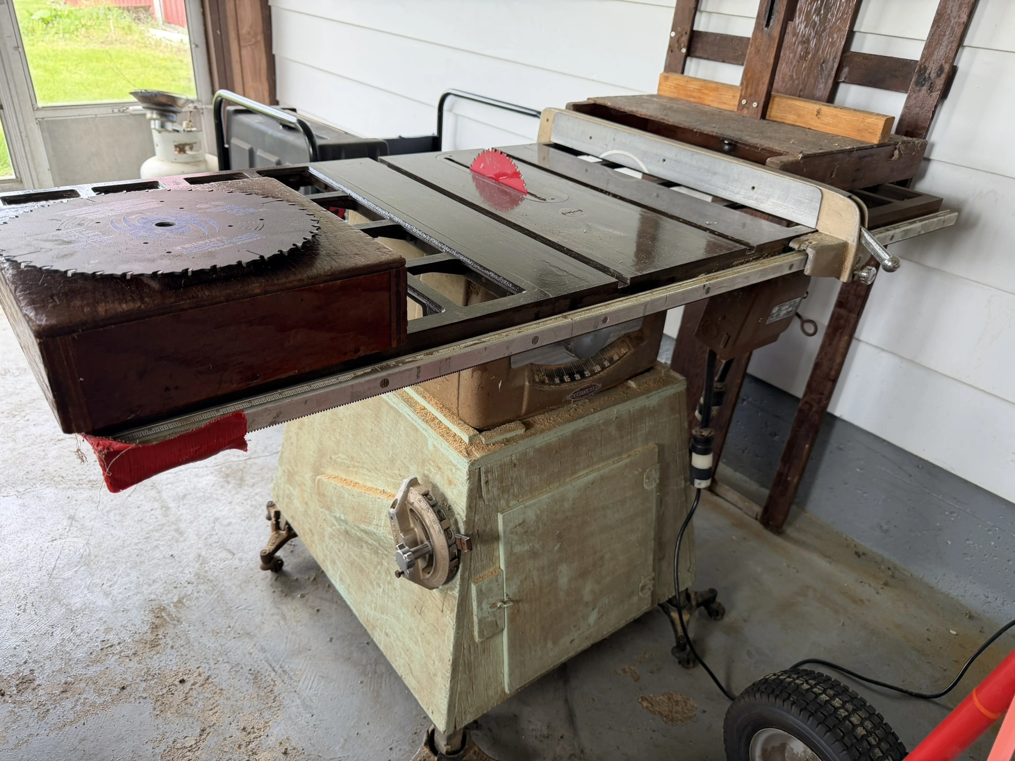 (1) Craftsman 10" table saw with stand, includes extra blades.