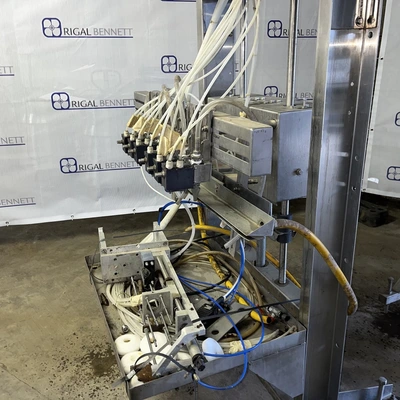 6 Head ELF Filler with feed tanks & container link belt conveyor