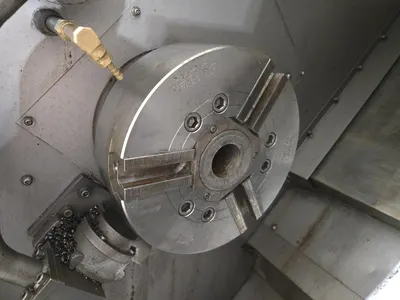 Hyundai SKT-300 CNC Lathe w/ Tailstock and Indexer, 10 Slot Turret, LNS Conveyor, 3-Jaw Chuck, Fanuc