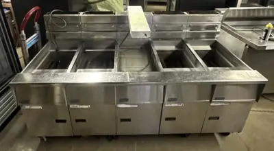 174-0002 Pitco SSH55 and SSHBN55 Battery of 4 Fryers with Middle Dump Station an
