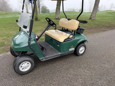 (1) 2015 E-Z-Go golf cart with a Kawasaki gas engine, does not include Club canopy, includes ball wa...