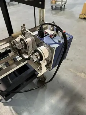 Advent model 310 semi-automatic pressure sensitive wraparound labeler