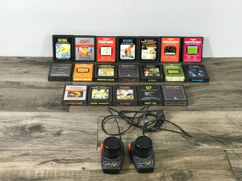 19 - Atari Video Games & 2 Paddle Controllers - see description for more info