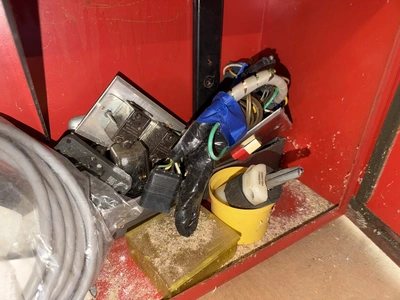 (2) Auto Call single door storage cabinets filled with assorted electrical items, including Push Mat...