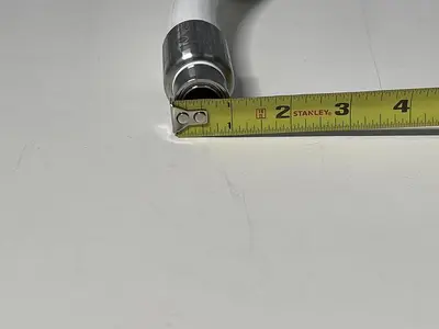 USED TSC 17" HOSE W/ 2" SANITARY ELBOW FITTING AND 1" SANITARY FITTING