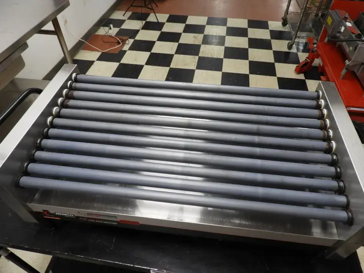 Used Nemco Used Nemco 8250-SLT 50 Commercial Hot Dog Roller Grill - Slanted Top, 120v Grills & Griddles Illinois US | Falcon Restaurant Supply #1376520