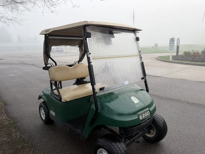 (1) 2015 E-Z-Go golf cart with a Kawasaki gas engine, includes canopy, ball cover, club cover, fold-...