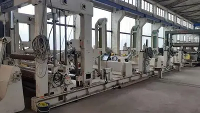USED 2001 TOSCHI TWO DRUM TISSUE SLITTER REWINDER