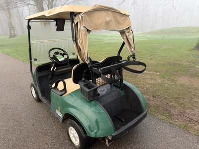 (1) 2015 E-Z-Go golf cart with a Kawasaki gas engine, includes canopy, ball cover, club cover, fold-...