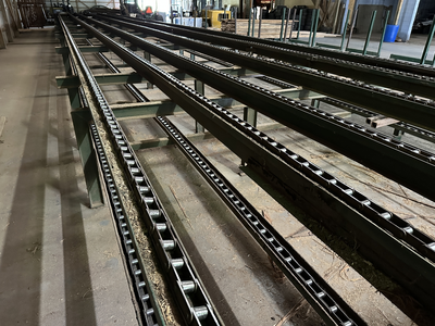 6 strand, 120' green chain with incoming deck and hoist. 24 heavy duty carts